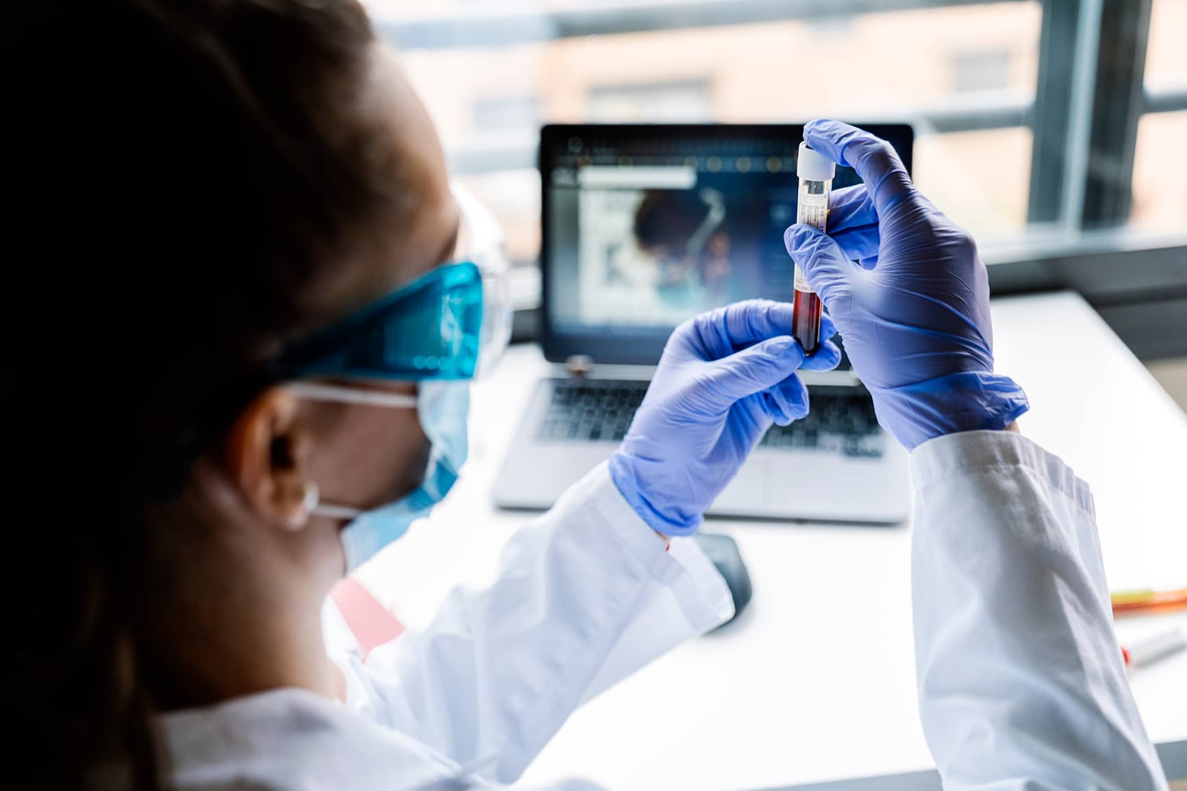 Scientist preparing a vaccine with special equipment in laboratory